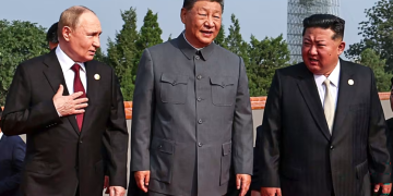 From left, Russian President Vladimir Putin, Xi and Kim at a military parade in Beijing