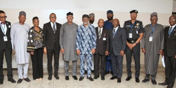 From L-R: Attorney General and Commissioner for Justice,Ondo State, Dr. Olukayode Ajulo (SAN); DG National Institute of Police Studies, Prof. Olu Ogunsakin; Senior Special Assistant to the President on Administration and Operations, Mrs Oyinade Nathan-Marsh; President Nigeria Bar Association, Mazi Afam Osigwe (SAN); Chairman NGF Committee on State Police/Governor of Ogun State, Prince Dapo Abiodun; Chief of Staff to the President, Rt. Hon. Femi Gbajabiamila; Special Assistant to the President on Legal Matters, Tomi Belgore; Attorney General of the Federation and Minister for Justice, Chief Lateef Olasunkanmi Fagbemi (SAN); Senior Special Assistant to the President on Planning and Research, Mr. Dubem Moghalu; Attorney General Lagos State and Commissioner for Justice, Mr. Lawal Pedro (SAN); Representative of Inspector General of Police, DIG Isyaku Mohammed; Director General NGF Secretariat, Dr. Adulateef Shittu; Director General Nigeria Law Reform Commission, Prof. Dakas Dakas, in a group photograph after the Inauguration of Presidential Working Group on State Policing, at the State House Abuja.