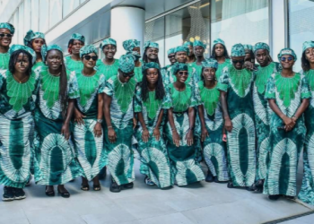Nigeria Super Falcons women's football team arriving in Rabat, Morocco, for the 2026 Women's Africa Cup of Nations, wearing traditional green-and-white Adire outfits