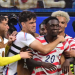 US forward #20 Folarin Balogun celebrates scoring his team's third goal with teammates during the 2026 World Cup Group D football match between USA and Paraguay