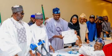 National Chairman of the APC, Prof. Nentawe Yilwatda recieves the formal submission of the duly completed nomination forms of Tinubu and Shettima