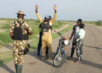 Musa Usman, 40-year-old senior finance chief of the Islamic State West Africa Province, ISWAP, surrendering to troops of operation Hadin Kai along with his kids