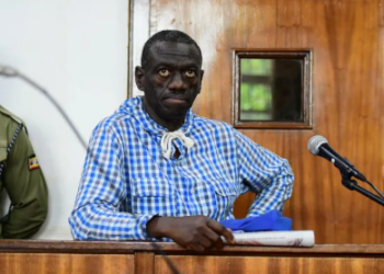 Ugandan opposition leader Dr. Kizza Besigye pictured in court during his treason trial before suffering a health emergency.