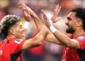 Egyptian players celebrate ouster of Australia in penalty shoot out at Arlington Stadium Friday.