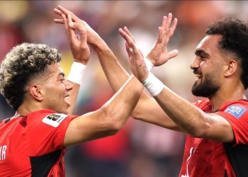Egyptian players celebrate ouster of Australia in penalty shoot out at Arlington Stadium Friday.