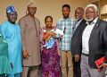 LUTH management staff celebrate with the Bolarindes after the delivery of a baby boy.