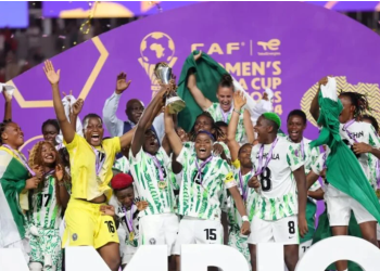 Super Falcons lifting the WAFCON trophy