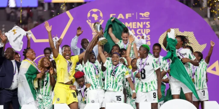 Super Falcons lifting the WAFCON trophy