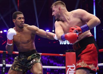 Former heavyweight champion Anthony Joshua battles Kristian Prenga during their bout in Jeddah, Saudi Arabia.