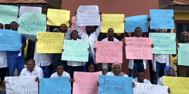 UITH doctors display placards over assault incident.