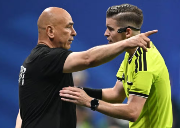 Egypt's head coach Hossam Hassan speaks with French referee Francois Letexier during the 2026 World Cup round of 16 football match between Argentina and Egypt at Atlanta Stadium in Atlanta on July 7, 2026