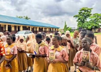 Secondary school students receive copies of Animal Farm under the Million Classics Programme