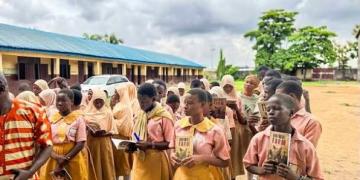 Secondary school students receive copies of Animal Farm under the Million Classics Programme