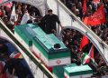 Crowds of mourners surround the convoy carrying the coffins of Iran’s slain supreme leader Ayatollah Ali Khamenei and members of his family during a funeral procession, before he is buried at the Shrine of Imam Reza, Iran’s most revered place of worship, in Mashhad on July 9, 2026.