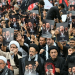 Shia Muslims holding portraits of Iran's Supreme Leader Mojtaba Khamenei and late leader Ali Khamenei