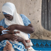 A woman breastfeeding her child