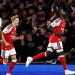 Bukayo Saka celebrates his goal with teammate against Coventry