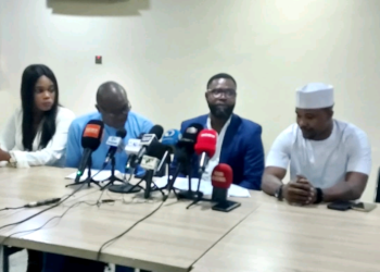 Officials and representatives of the Police Integrity Organisation address journalists during a press briefing