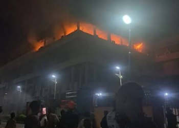 Image of the Federal Mortgage Bank of Nigeria headquarters in Abuja engulfed by flames before emergency responders were deployed to contain the fire and prevent further spread.