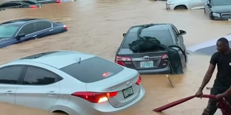 Several vehicles are submerged in floodwater after heavy rainfall causes flooding in parts of Abuja, highlighting growing concerns over drainage infrastructure, blocked waterways and rapid urban development in the Federal Capital Territory.