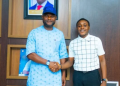 Edo Deputy Governor, Dennis Idahosa, presents a N1 million cash gift to 2026 UTME high-flyer, Daniel Osagiobare, in recognition of his outstanding performance in the examination.
