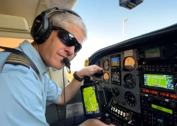 Kevin Rideout makes preflight checks before transporting a team from Hope Springs International in Niger.