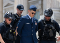US Capitol Police detain US Air Force Maj. Jason Watson on the steps of the US Capitol during a protest calling for the impeachment of President Donald Trump.