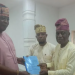 General Secretary of the Fusengbuwa Ruling House, Prince Adeleke Adeyemi receives the 25-page report of the nine-member Fact-Finding Committee from the committee's chairman, Prince Olusegun Olusoga and Secretary, Adeyemo Oduneye.