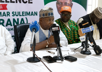 Officials and stakeholders at a press conference addressing journalists during the event