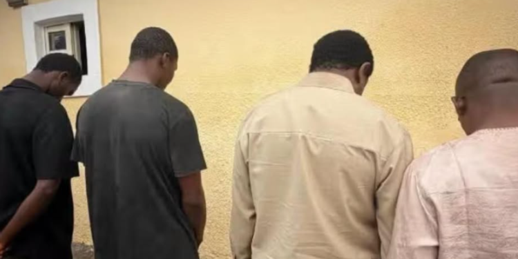 Police officers parade four suspects allegedly linked to an organ harvesting and human trafficking syndicate uncovered in Auta Balifi, Karu Local Government Area of Nasarawa State.