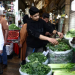 People shop at a market, amid the US-Israel conflict with Iran, in Tehran, Iran