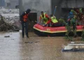 Rescue teams search for missing people and assess the destruction caused by flash floods in Nepal