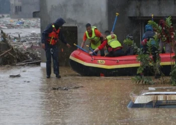 Rescue teams search for missing people and assess the destruction caused by flash floods in Nepal