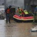 Rescue teams search for missing people and assess the destruction caused by flash floods in Nepal
