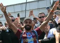 Egyptian forward Mohamed Salah gestures as he arrives at Istanbul Ataturk Airport to complete his transfer to Turkish football club Trabzonspor