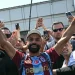 Egyptian forward Mohamed Salah gestures as he arrives at Istanbul Ataturk Airport to complete his transfer to Turkish football club Trabzonspor