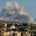 Smoke rises following an Israeli-controlled explosion in the village of Kfartibnit, as seen from Nabatieh in southern Lebanon