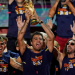 Spain's Rodri celebrates with the World Cup trophy and teammates on stage at Cibeles Square in Madrid after the July victory parade