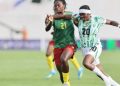 Indomitable Lionesses defender tackles a Super Falcons forward player