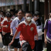 Students stream out of Debsirin Nonthaburi School in Nonthaburi province, Thailand, following the shooting that left seven people dead and 23 others injured.