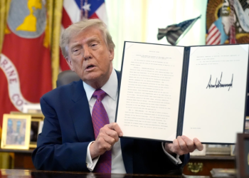 US President Donald Trump signs an executive order renaming Lake Ontario as “Lake America” at the White House, amid escalating tensions between the United States and Canada.