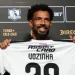 Colo Colo new signing Vozinha poses with the club shirt