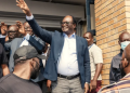 Presidential candidate Brian Muntayalwa Mundubile waves at supporters in Lusaka, Zambia