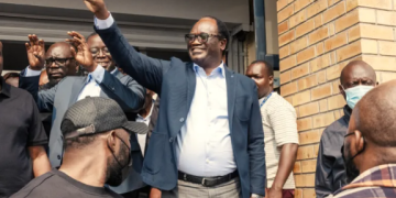 Presidential candidate Brian Muntayalwa Mundubile waves at supporters in Lusaka, Zambia