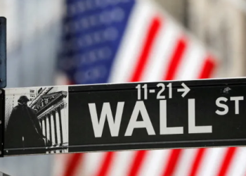 A street sign for Wall Street is seen outside the New York Stock Exchange, NYSE, in New York City, New York, United States
