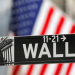 A street sign for Wall Street is seen outside the New York Stock Exchange, NYSE, in New York City, New York, United States