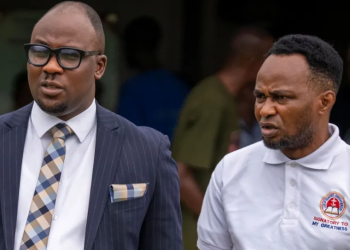 Adeniyi Mobolaji Kayode, leaves court with his lawyer on Thursday