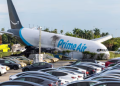 An Amazon Air cargo plane rests on its nose Sunday after overshooting the runway at Miami International Airport.