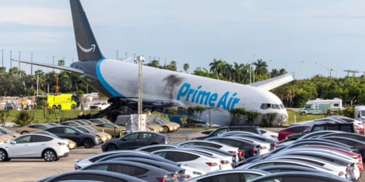 An Amazon Air cargo plane rests on its nose Sunday after overshooting the runway at Miami International Airport.