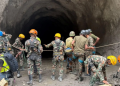 Army personnel have resorted to using explosives to blast into the hillside to reach the trapped workers
